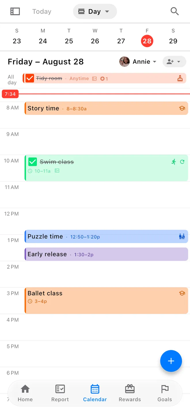 A phone showing a day of the family calendar: Annie's morning of story time and swim class, and the school calendar's early release in its own colour among them.